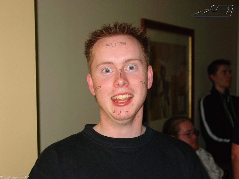 NMC with a heap of PS2 removeable tats over his face 
