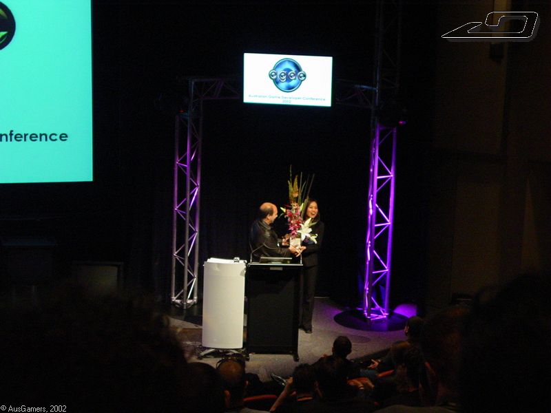 AGDC presentations - Pon accepting a thankyou present 
